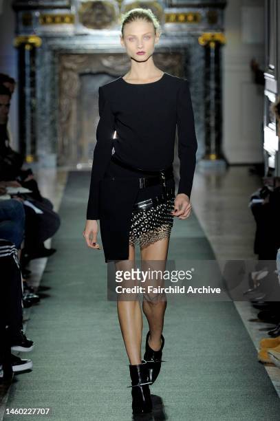 Model on the runway at Anthony Vaccarello's fall 2013 show at Hotel Salomon de Rothschild.