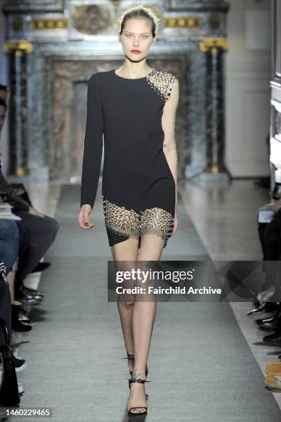 Model on the runway at Anthony Vaccarello's fall 2013 show at Hotel Salomon de Rothschild.