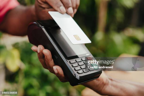 payment by credit card approximation - paying with credit card bildbanksfoton och bilder