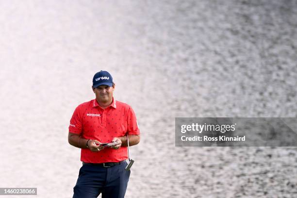 Patrick Reed of The United States looks on across the 7th green during the continuation of Round Two on Day Three of the Hero Dubai Desert Classic at...