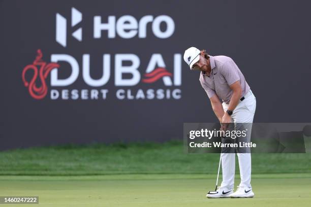 Tommy Fleetwood of England putts on the 18th green during the continuation of Round Two on Day Three of the Hero Dubai Desert Classic at Emirates...