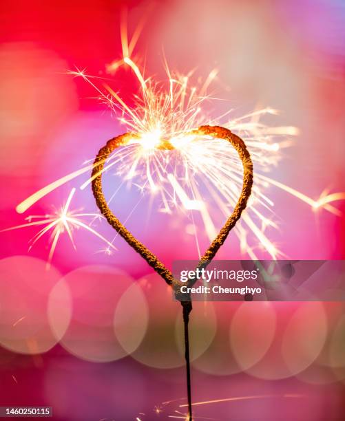 heart shaped sparkler - heart stock pictures, royalty-free photos & images