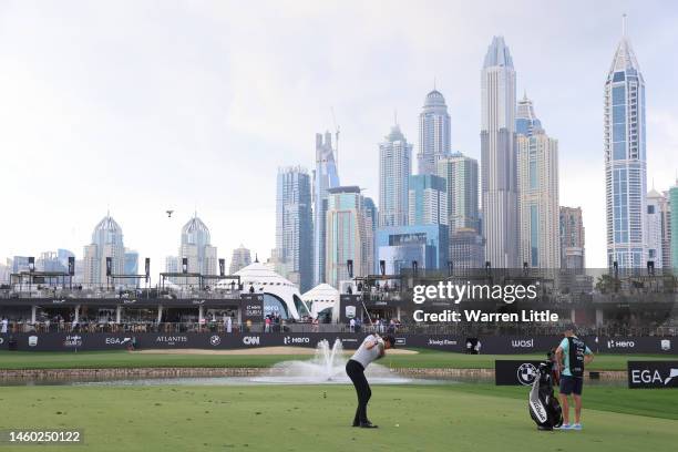 Thomas Pieters of Belgium plays their third shot on the 18th hole during the continuation of Round Two on Day Three of the Hero Dubai Desert Classic...