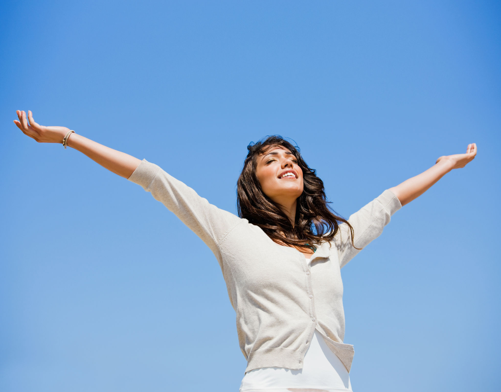 Beautiful young woman with arms raised Beautiful young woman with arms raised