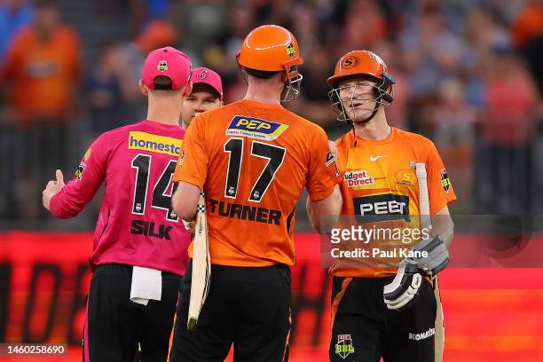 Ashton Turner and Cameron Bancroft of the Scorchers celebrate winning the Men's Big Bash League match between the Perth Scorchers and the Sydney...