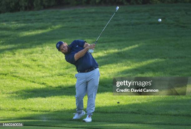 Andrew Johnston of England plays his second shot on the ninth hole during the completion of the second round on Day Three of the Hero Dubai Desert...