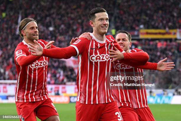 Michael Gregoritsch of SC Freiburg celebrates with teammates after scoring the team's first goal during the Bundesliga match between Sport-Club...