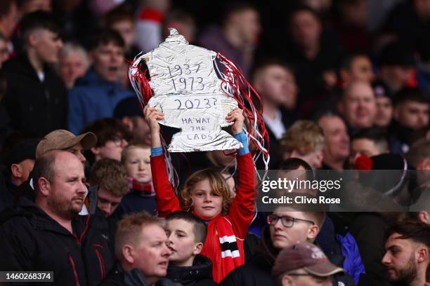 Fan holds a tinfoil FA Cup trophy prior to the Emirates FA Cup Fourth Round match between Fulham and Sunderland at Craven Cottage on January 28, 2023...