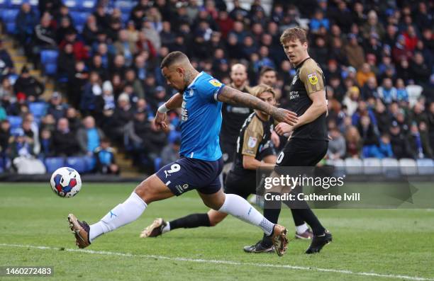 Jonson Clarke-Harris of Peterborough United scores the first goal during the Sky Bet League One between Peterborough United and Portsmouth at London...