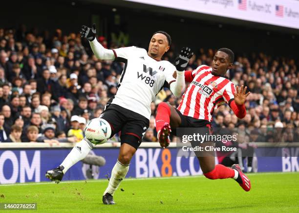 Kenny Tete of Fulham is challenged by Abdoullah Ba of Sunderland during the Emirates FA Cup Fourth Round match between Fulham and Sunderland at...