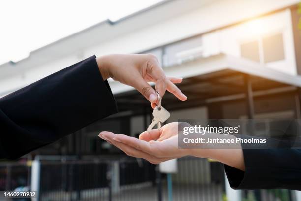 these are the keys of your new home - handing over keys stock pictures, royalty-free photos & images