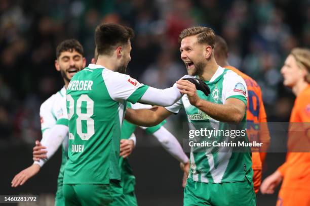 Niclas Fuellkrug of SV Werder Bremen celebrates after scoring the team's second goal with teammate Ilia Gruev during the Bundesliga match between SV...