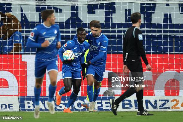 Ihlas Bebou of TSG Hoffenheim celebrates after scoring the team's first goal with teammates during the Bundesliga match between TSG Hoffenheim and...