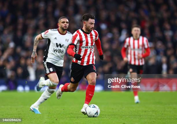 Patrick Roberts of Sunderland runs with the ball from Layvin Kurzawa of Fulham during the Emirates FA Cup Fourth Round match between Fulham and...