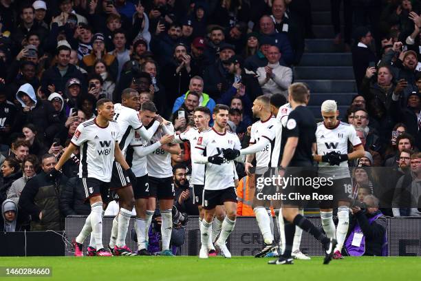 Tom Cairney of Fulham celebrates with teammates after scoring the team's first goal during the Emirates FA Cup Fourth Round match between Fulham and...