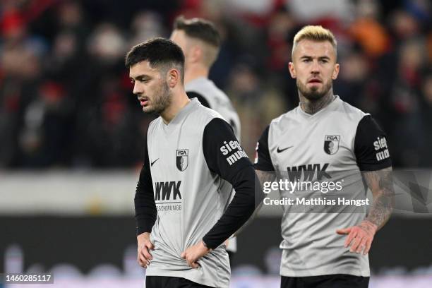 David Colina and Niklas Dorsch of FC Augsburg looks dejected following the team's defeat in the Bundesliga match between Sport-Club Freiburg and FC...