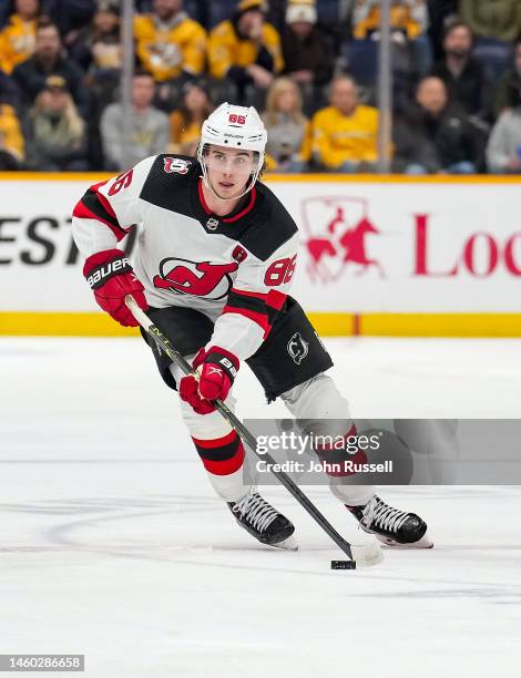 Jack Hughes of the New Jersey Devils skates against the Nashville Predators during an NHL game at Bridgestone Arena on January 26, 2023 in Nashville,...