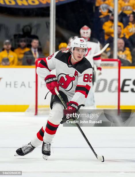 Jack Hughes of the New Jersey Devils skates against the Nashville Predators during an NHL game at Bridgestone Arena on January 26, 2023 in Nashville,...