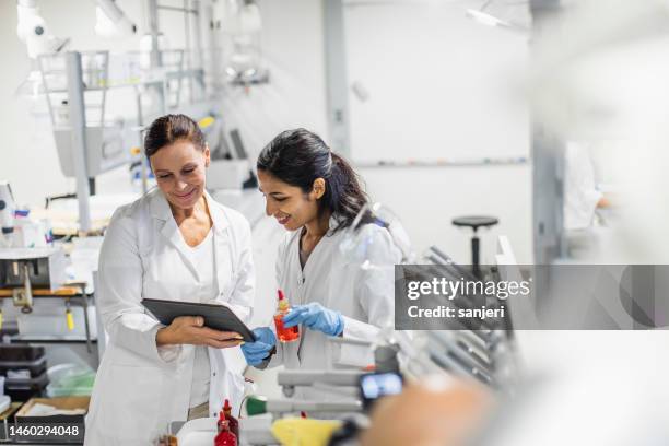scientists working in the laboratory - biotechnology industry stock pictures, royalty-free photos & images