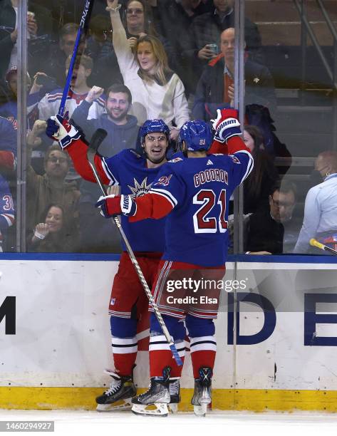 Chris Kreider of the New York Rangers is congratulated by teammate Barclay Goodrow after he scored in the first period against the Vegas Golden...