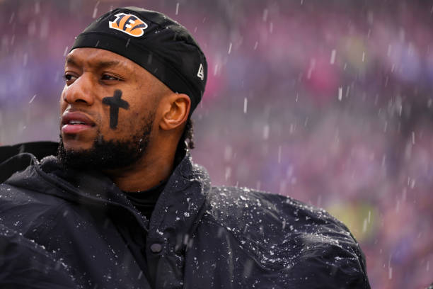 Joe Mixon of the Cincinnati Bengals stands during the national anthem against the Buffalo Bills at Highmark Stadium on January 22, 2023 in Orchard...