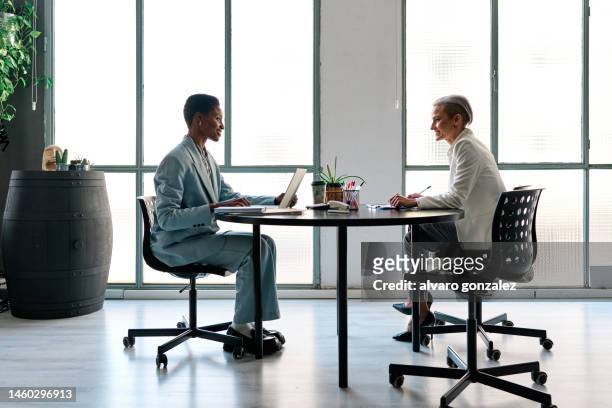 two lawyers working sitting in the office - future proof stock pictures, royalty-free photos & images