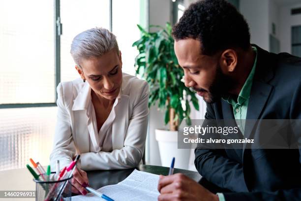 lawyer during a meeting with a customer - plastic bags stock pictures, royalty-free photos & images