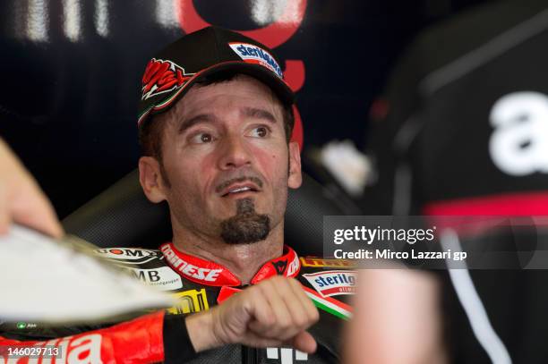 Max Biaggi of Italy and Aprilia Racing Team looks on in box during the second day of practice of round 7' of 2012 Superbike FIM World Championship at...