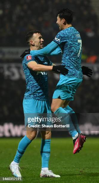 Son Heung-Min celebrates with Ivan Perisic of Tottenham Hotspur after scoring the team's second goal during the Emirates FA Cup Fourth Round match...