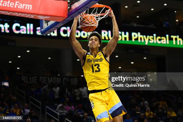 Oso Ighodaro of the Marquette Golden Eagles dunks in the first half of the game against the DePaul Blue Demons at Wintrust Arena on January 28, 2023...