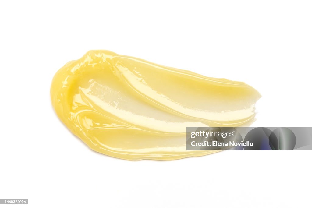 Texture Stroke yellow cream gel cosmetic smudge.