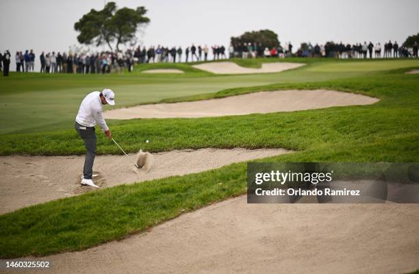 Lanto Griffin of the United States plays second shot from a bunker on the first hole during the final round of the Farmers Insurance Open on the...