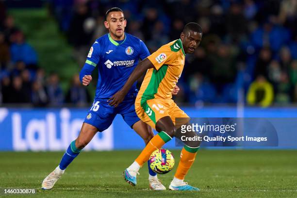 Angel Algobia of Getafe CF battle for the ball with William Carvalho of Real Betis during the LaLiga Santander match between Getafe CF and Real Betis...