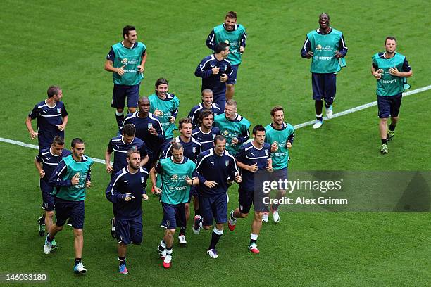 Players of Italy warm up during a UEFA EURO 2012 training session ahead of their Group C match against Spain at the Municipal Stadium on June 9, 2012...