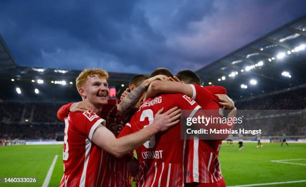 Philipp Lienhart of SC Freiburg celebrates with teammates after scoring the team's third goal during the Bundesliga match between Sport-Club Freiburg...