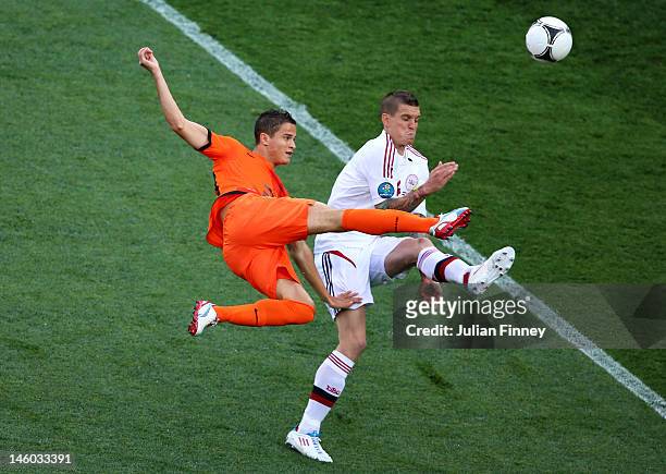 Ibrahim Afellay of Netherlands and Daniel Agger of Denmark compete for the ball during the UEFA EURO 2012 group B match between Netherlands and...