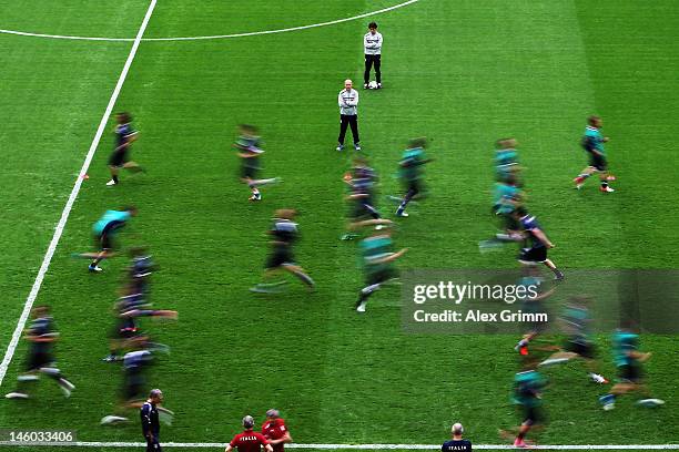 Players of Italy warm up during a UEFA EURO 2012 training session ahead of their Group C match against Spain at the Municipal Stadium on June 9, 2012...