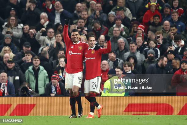 Casemiro of Manchester United celebrates with teammate Antony after scoring the team's first goal during the Emirates FA Cup Fourth Round match...