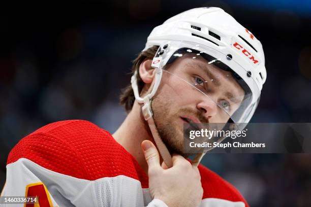 Rasmus Andersson of the Calgary Flames looks on during the second period against the Seattle Kraken at Climate Pledge Arena on January 27, 2023 in...