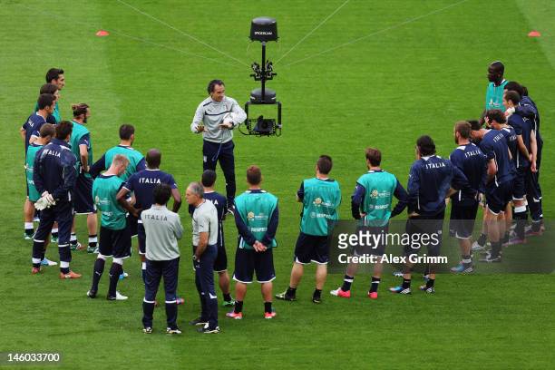 Head coach Cesare Prandelli of Italy talks to players during a UEFA EURO 2012 training session ahead of their Group C match against Spain at the...