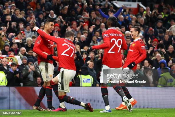 Casemiro of Manchester United celebrates with teammates Wout Weghorst, Aaron Wan-Bissaka and Antony after scoring the team's first goal during the...