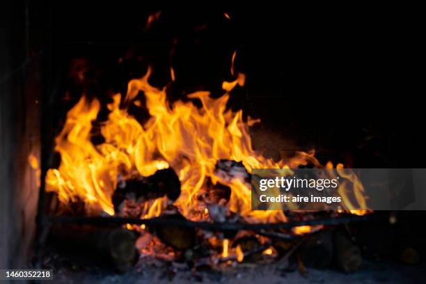 ember of burning wood-fired oven seen in close-up with the movement of the fire somewhat blurred, front view - campfire background stock pictures, royalty-free photos & images