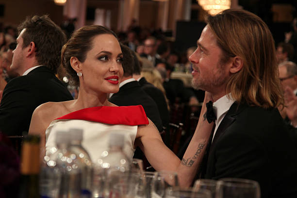69th ANNUAL GOLDEN GLOBE AWARDS -- Pictured: Angelina Jolie, Brad Pitt during the 69th Annual Golden Globe Awards held at the Beverly Hilton Hotel on...