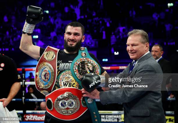 Artur Beterbiev celebrates with their Title Belts after defeating Anthony Yarde during the IBF, WBC, WBO World Light Heavyweight Title fight between...