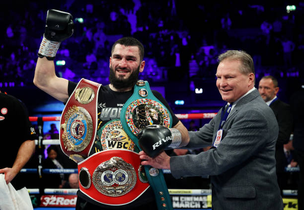 Artur Beterbiev celebrates with their Title Belts after defeating Anthony Yarde during the IBF, WBC, WBO World Light Heavyweight Title fight between...