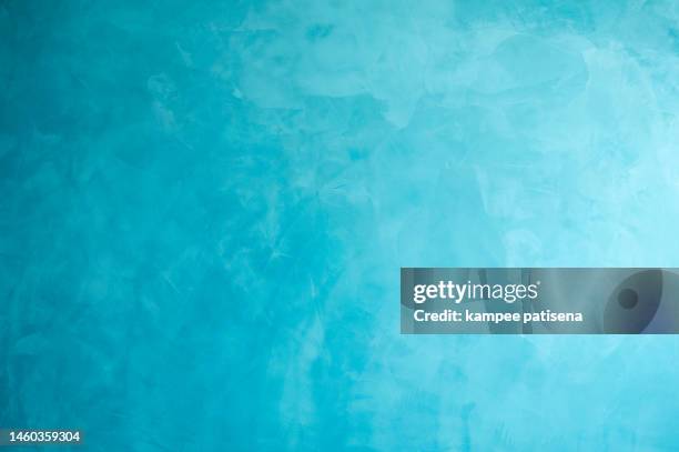 close-up of plastered concrete wall painted in blue - background paint room stock pictures, royalty-free photos & images
