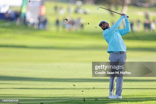 Max Homa of the United States plays his shot on the 15th hole during the final round of the Farmers Insurance Open on the South Course of Torrey...
