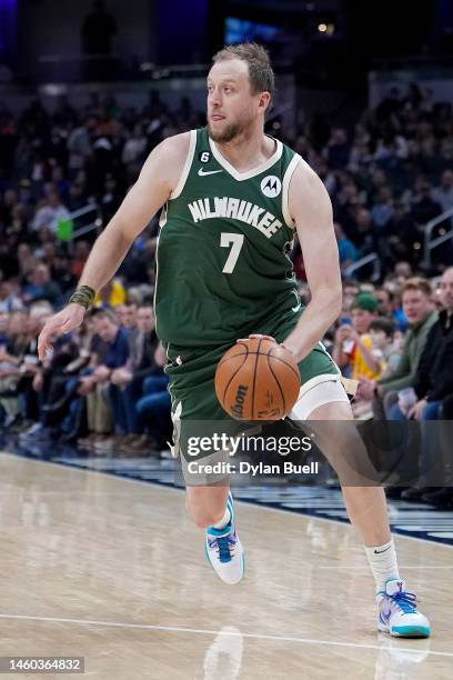 Joe Ingles of the Milwaukee Bucks dribbles the ball in the first quarter against the Indiana Pacers at Gainbridge Fieldhouse on January 27, 2023 in...