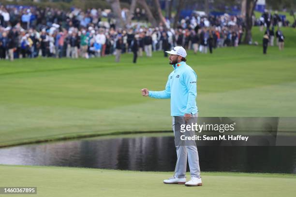 Max Homa of the United States celebrates on the 18th green after the final round of the Farmers Insurance Open on the South Course of Torrey Pines...