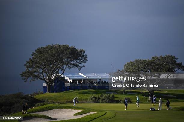 Collin Morikawa of the United States putts on the 14th green during the final round of the Farmers Insurance Open on the South Course of Torrey Pines...